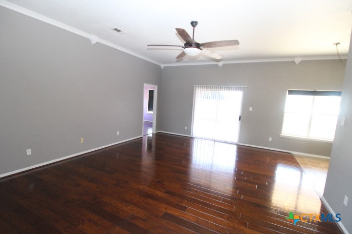 775 Cactus Lane Copperas Cove, TX 76522 - Photo 12 of 22 an empty room with wooden floor fan and windows