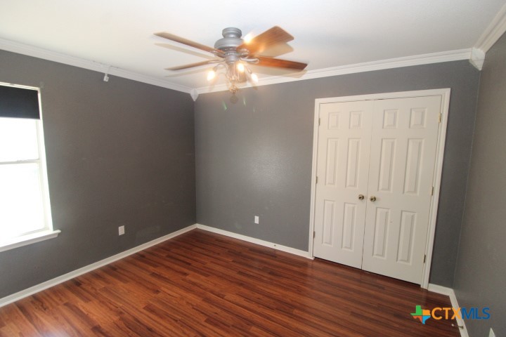 775 Cactus Lane Copperas Cove, TX 76522 - Photo 15 of 22 a view of an empty room with wooden floor and a window