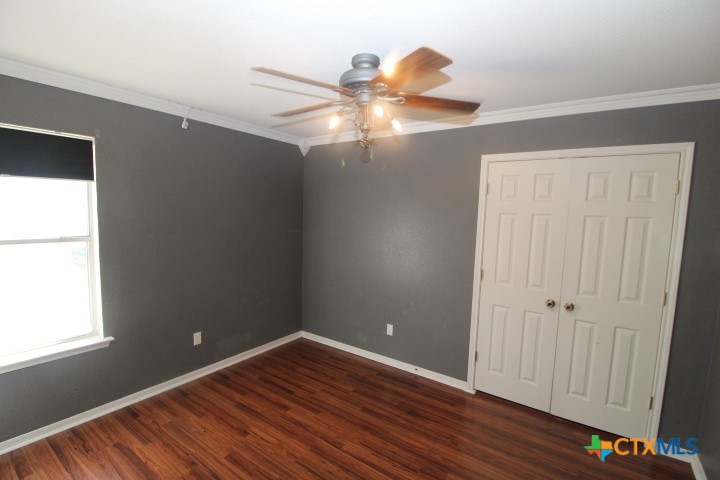 775 Cactus Lane Copperas Cove, TX 76522 - Photo 16 of 22 a view of an empty room with wooden floor and a window