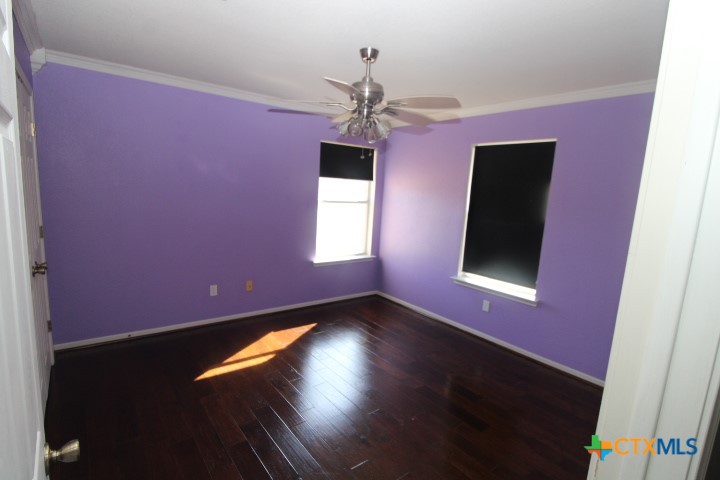775 Cactus Lane Copperas Cove, TX 76522 - Photo 18 of 22 a view of empty room with wooden floor and fan
