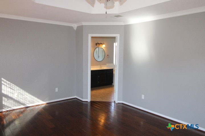 775 Cactus Lane Copperas Cove, TX 76522 - Photo 7 of 22 an empty room with wooden floor and windows