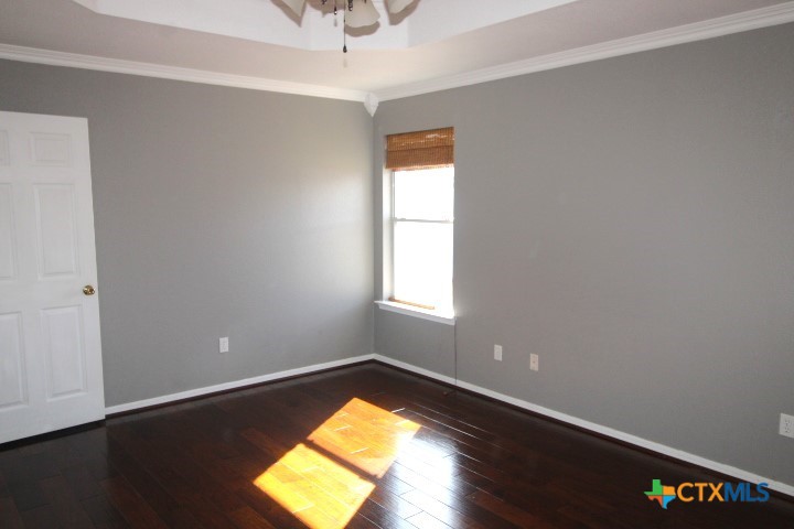 775 Cactus Lane Copperas Cove, TX 76522 - Photo 9 of 22 a view of empty room with wooden floor and fan