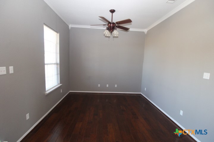 775 Cactus Lane Copperas Cove, TX 76522 - Photo 10 of 22 wooden floor in an empty room with a window