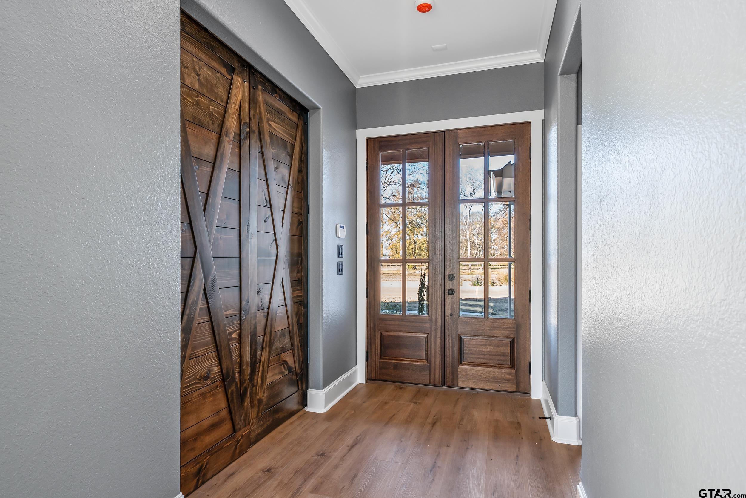 12241 Madison Crossing Bullard, TX 75757 - Photo 27 of 38 wooden floor in a room next to a window