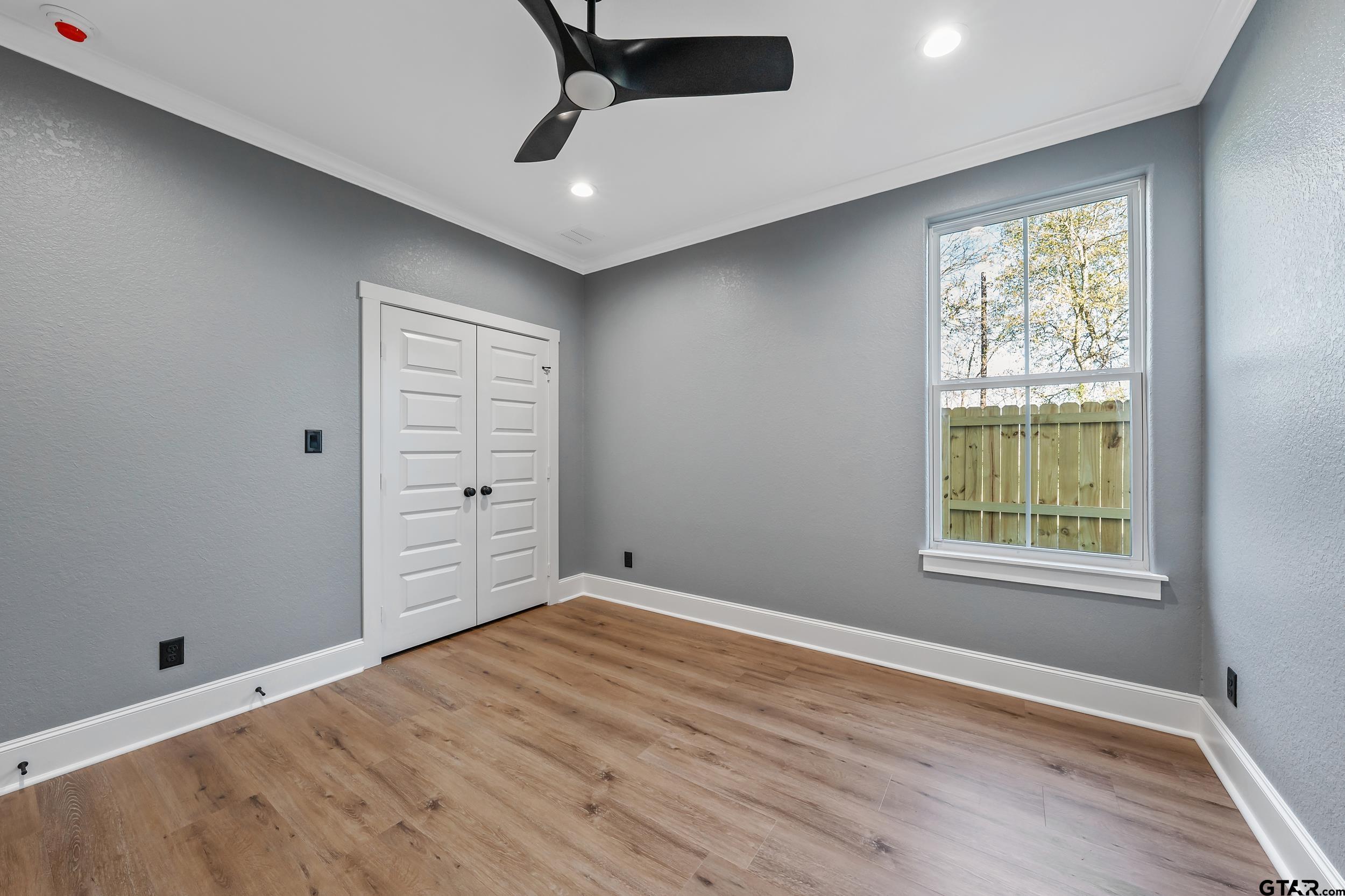 12241 Madison Crossing Bullard, TX 75757 - Photo 29 of 38 wooden floor in an empty room with a window
