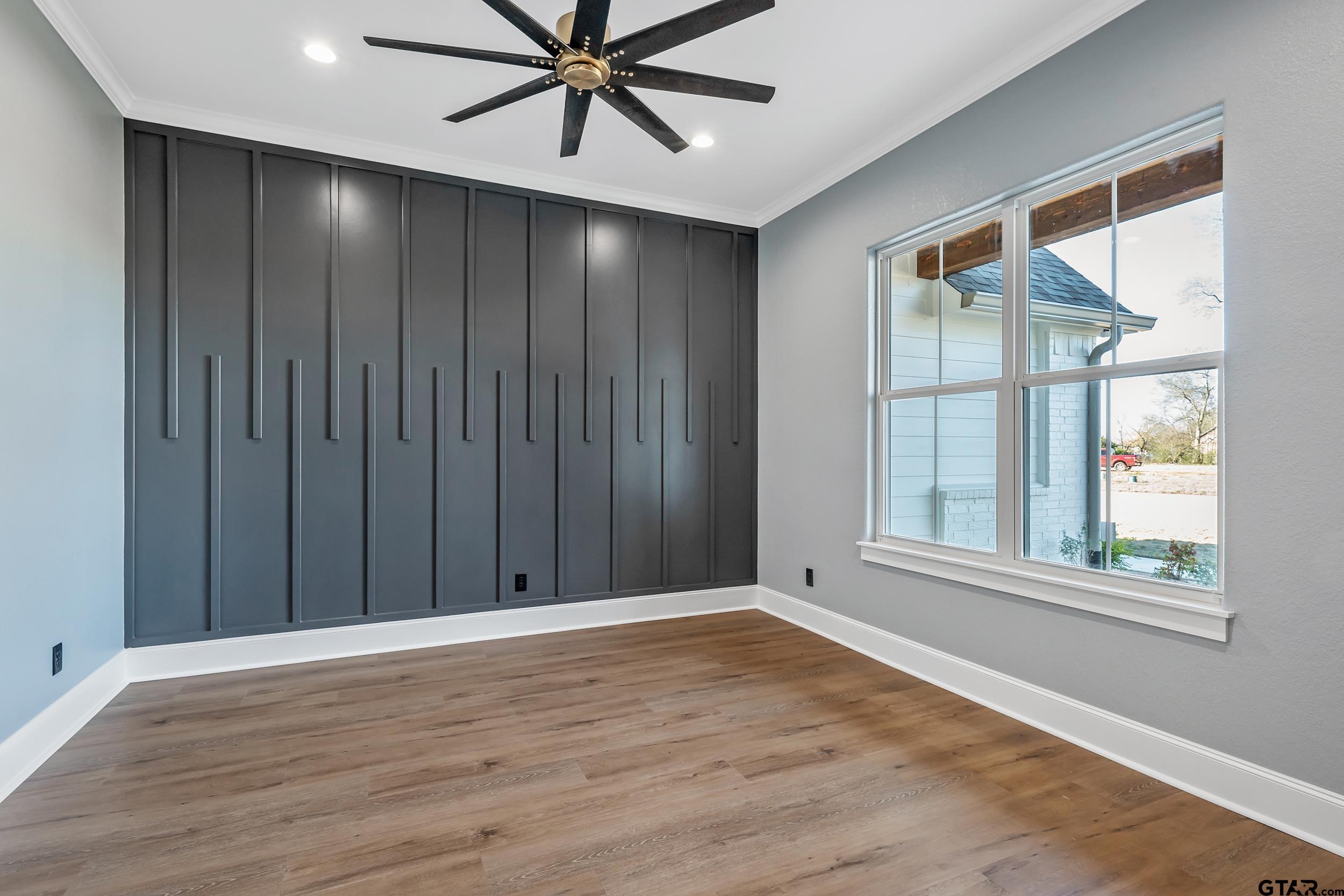 12241 Madison Crossing Bullard, TX 75757 - Photo 34 of 38 a view of an empty room with a window and wooden floor