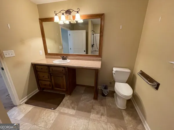 a bathroom with a sink and a toilet