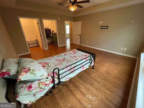 a bedroom with bed and a window