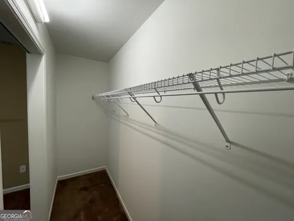 a view of storage and utility room with racks on the wall