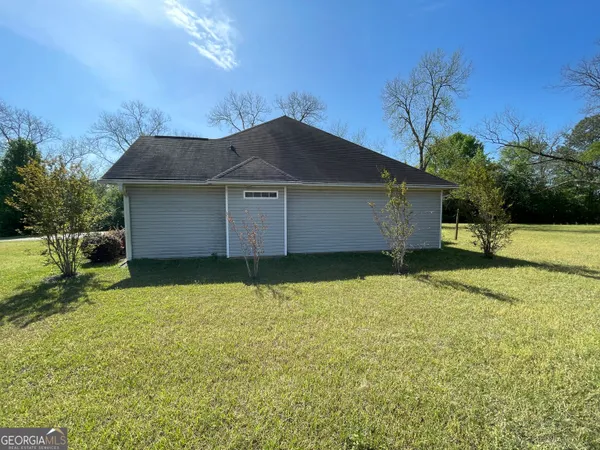 a view of a house with a garden