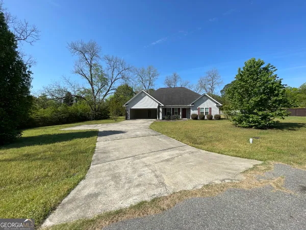 a swimming pool with trees in the background
