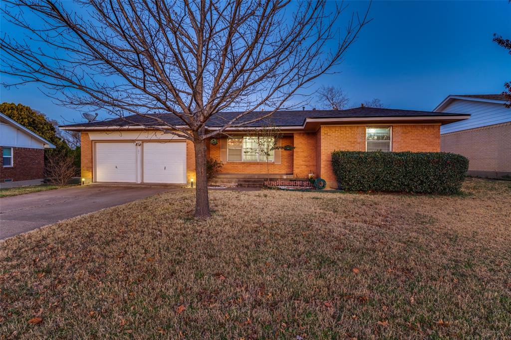 2406 Ridgecrest Drive Garland, TX 75041 - Photo 1 of 1 Single story home with brick siding, a garage, driveway, and a front yard