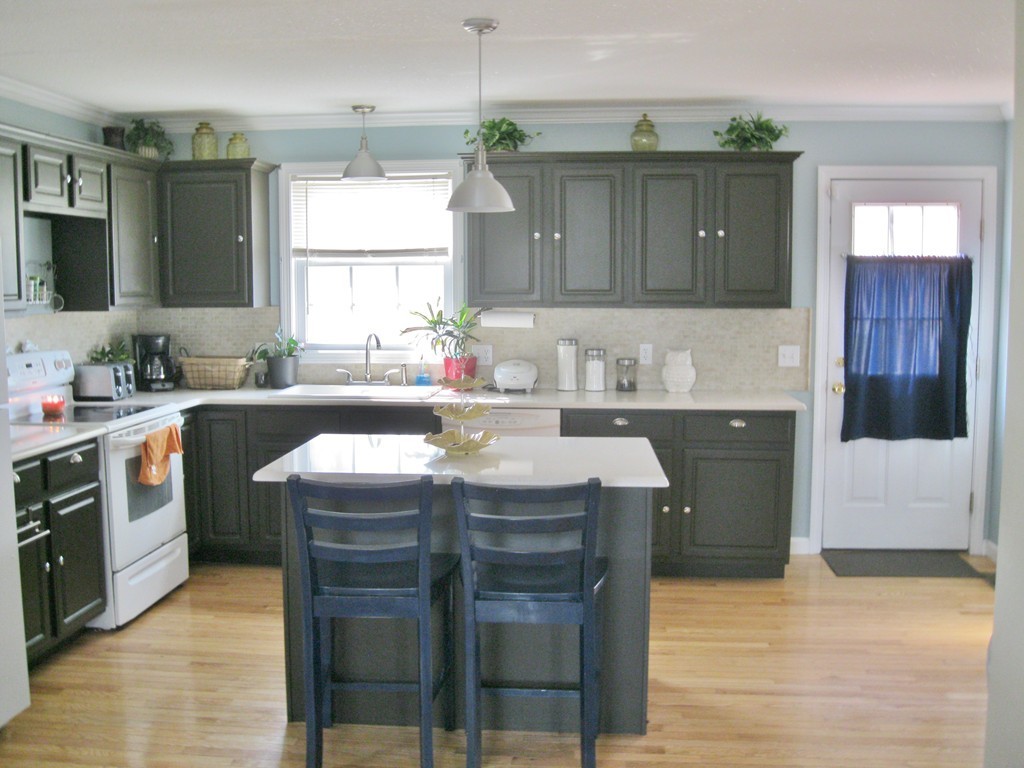 38 Slater Avenue Springfield, MA 01119 - Photo 10 of 30 a kitchen with a sink and wooden cabinets