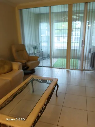 a white refrigerator freezer sitting in a kitchen