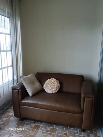 a living room with a table and chairs