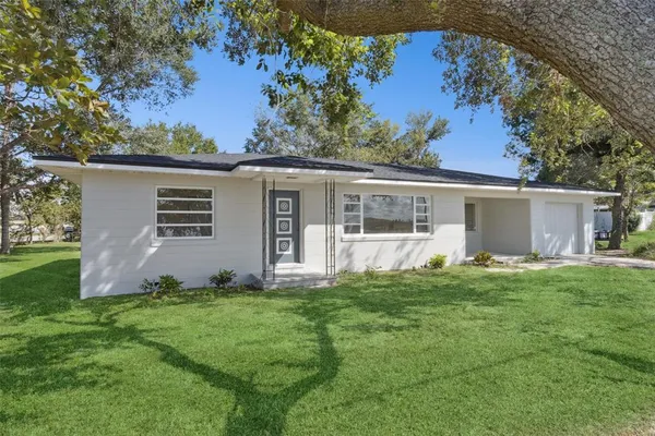 front view of a house with a yard