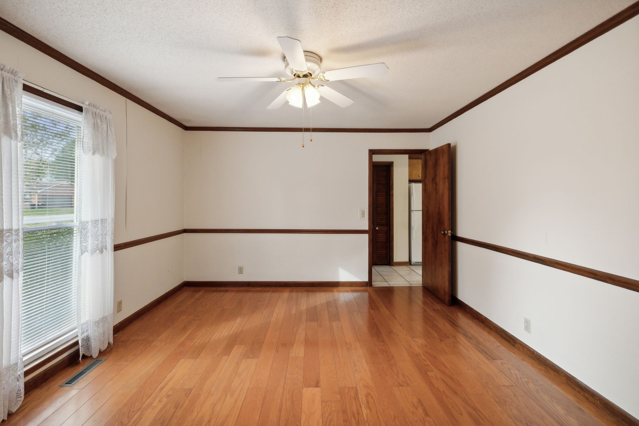 4068 Confederate Road Murfreesboro, TN 37128 - Photo 11 of 53 Formal Dining Room is spacious with a view to the front yard, chair rail and finished wood plank flooring! Access to the Kitchen is straight through the doorway.