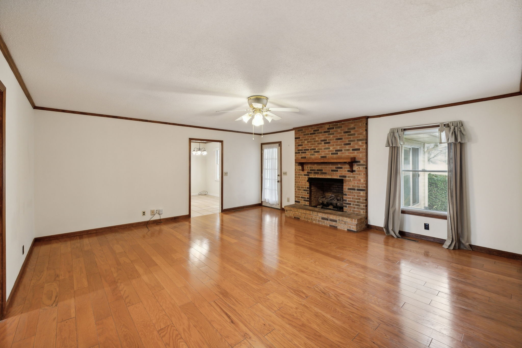 4068 Confederate Road Murfreesboro, TN 37128 - Photo 14 of 53 The Living Room with a propane gas Fireplace and finished wood plank flooring!