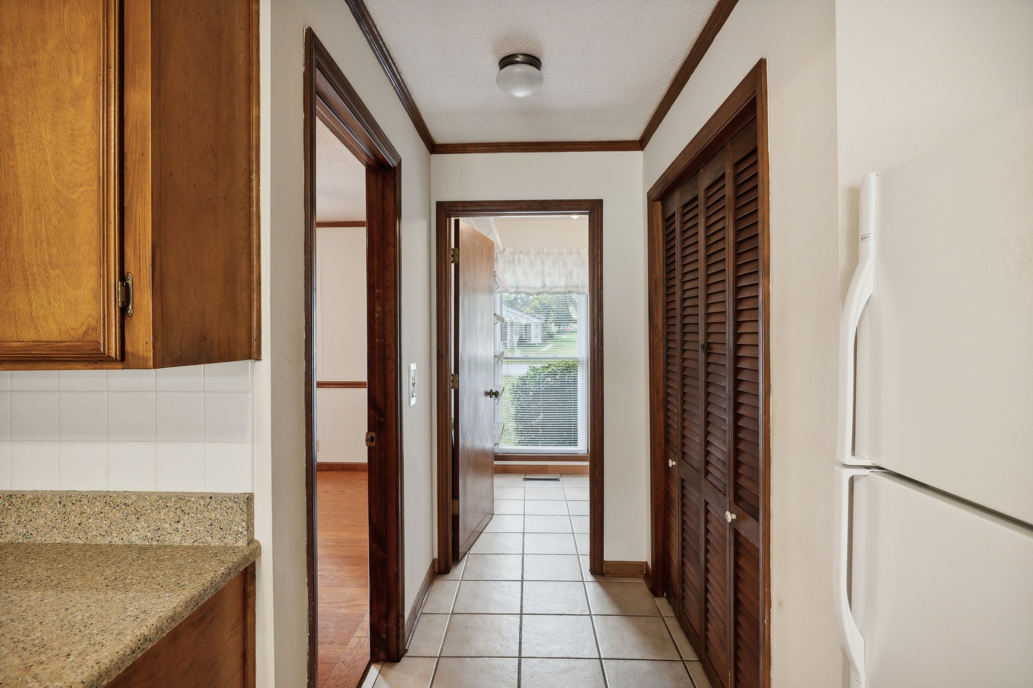 4068 Confederate Road Murfreesboro, TN 37128 - Photo 20 of 53 A view of the doorway to Dining Room, straight ahead to the Laundry Room, and the Pantry closet to the right.