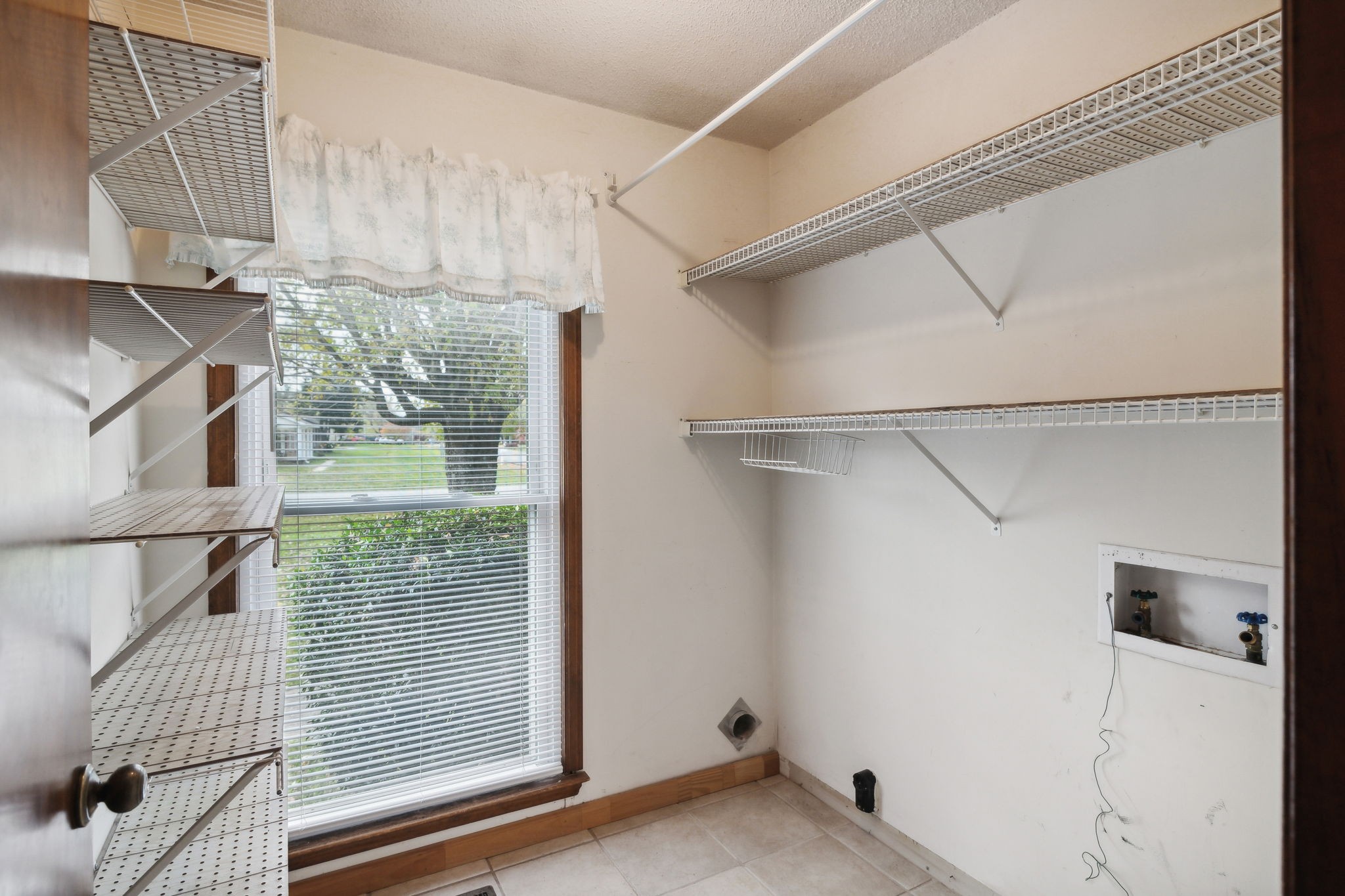 4068 Confederate Road Murfreesboro, TN 37128 - Photo 21 of 53 The Laundry Room with shelving and hook-ups for electric washer & dryer.
