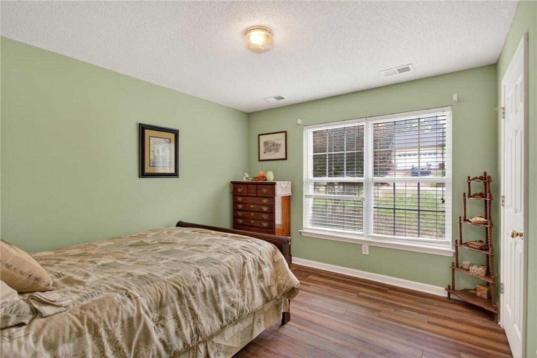 207 Hunters Lane Anderson, SC 29625 - Photo 25 of 46 3 bedrooms are on the opposite side of the home than the primary bedroom. Bedroom 1 of 4.