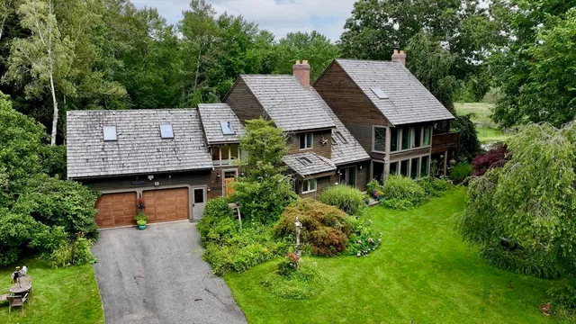 an aerial view of a house and garden space