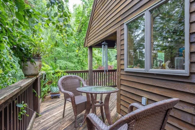 a view of a two chairs in the balcony
