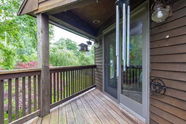 a view of a balcony with wooden floor