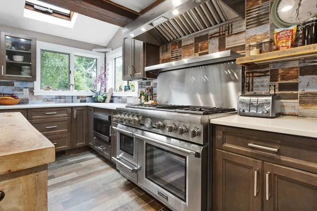 a kitchen with a stove and a sink