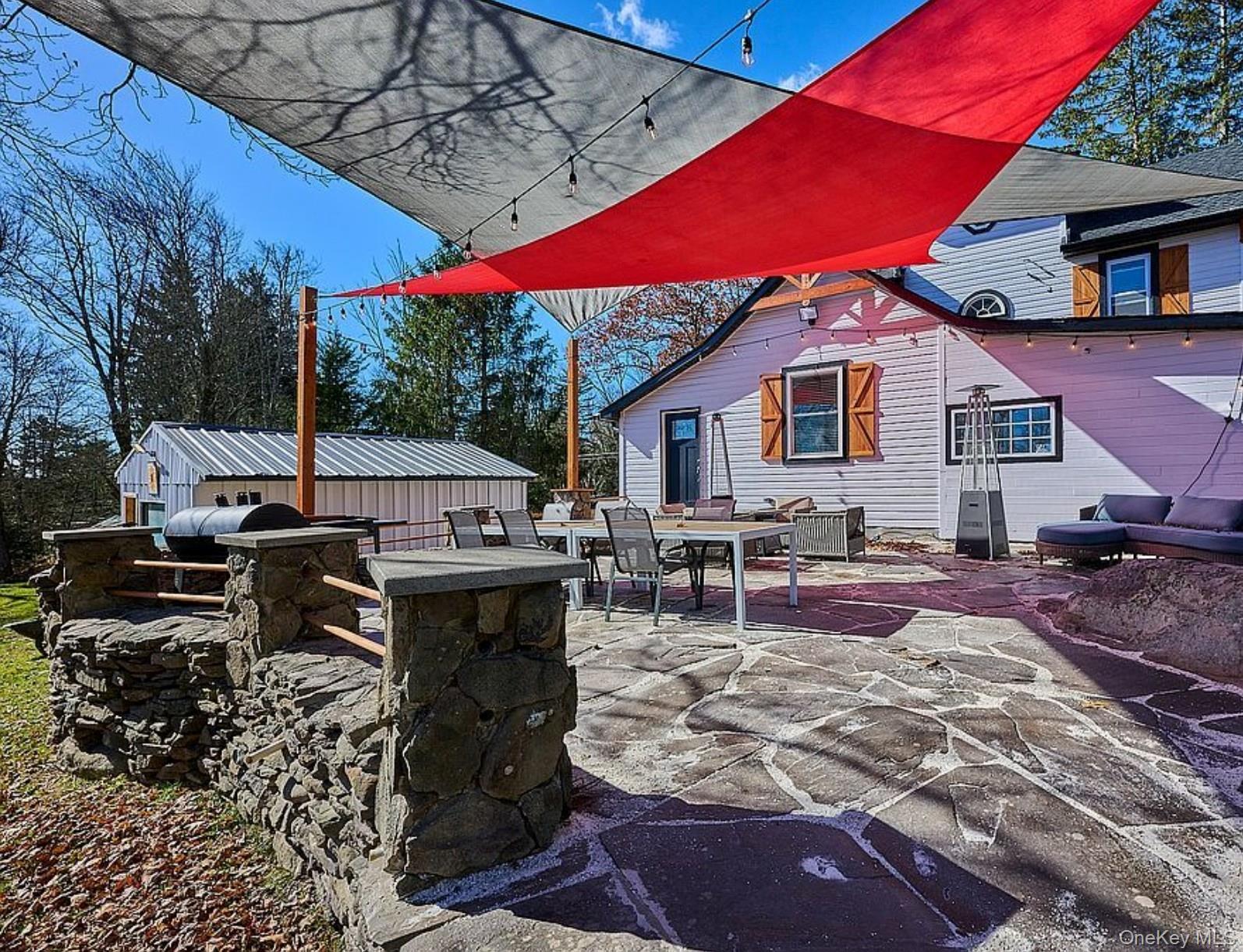 541 Cold Spring Road Monticello, NY 12701 - Photo 24 of 31 a view of a chairs and table in the patio