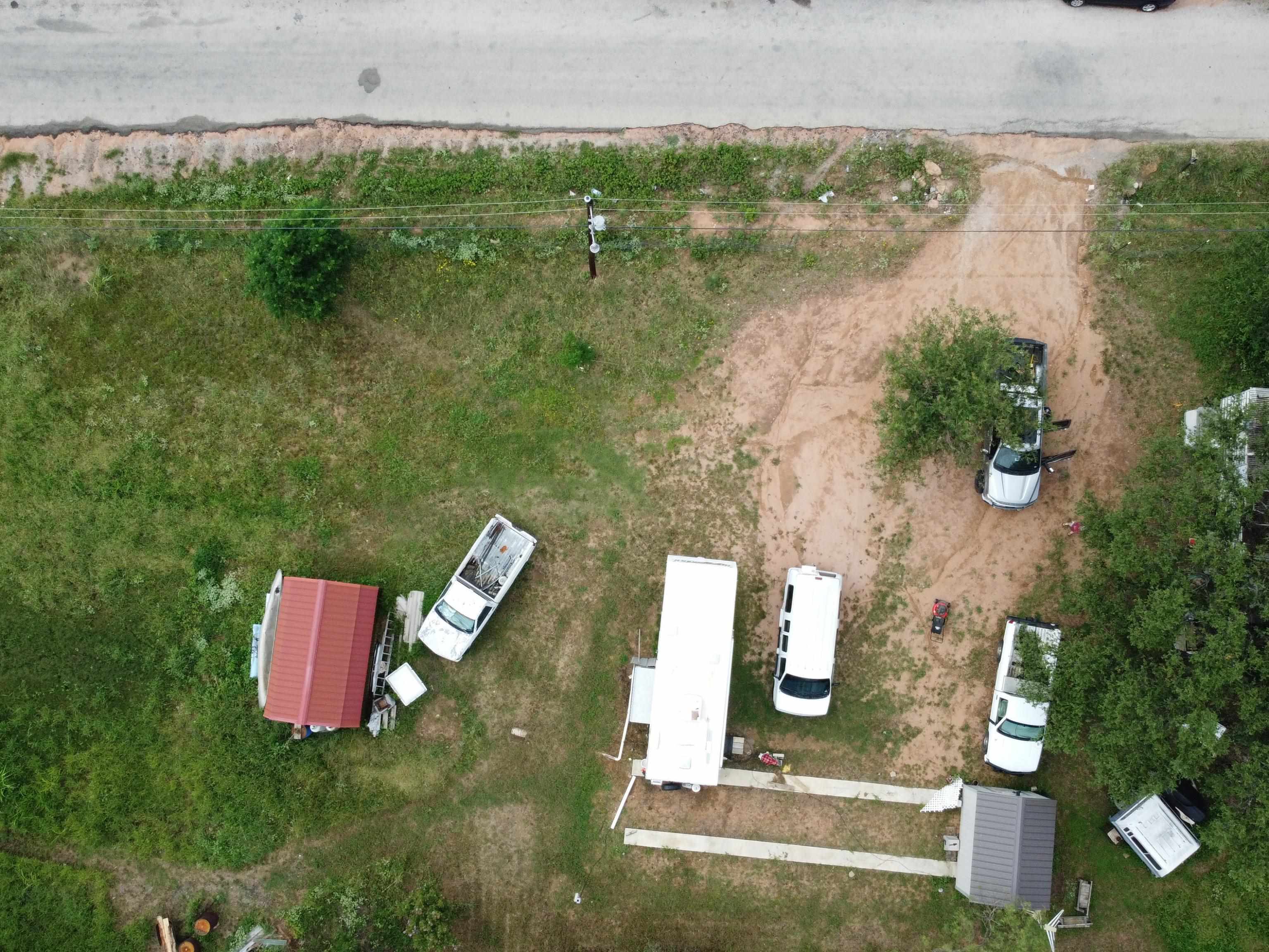 601 Breezy Lane Kingsland, TX 78639 - Photo 2 of 7 an aerial view of a house with outdoor space and lake view