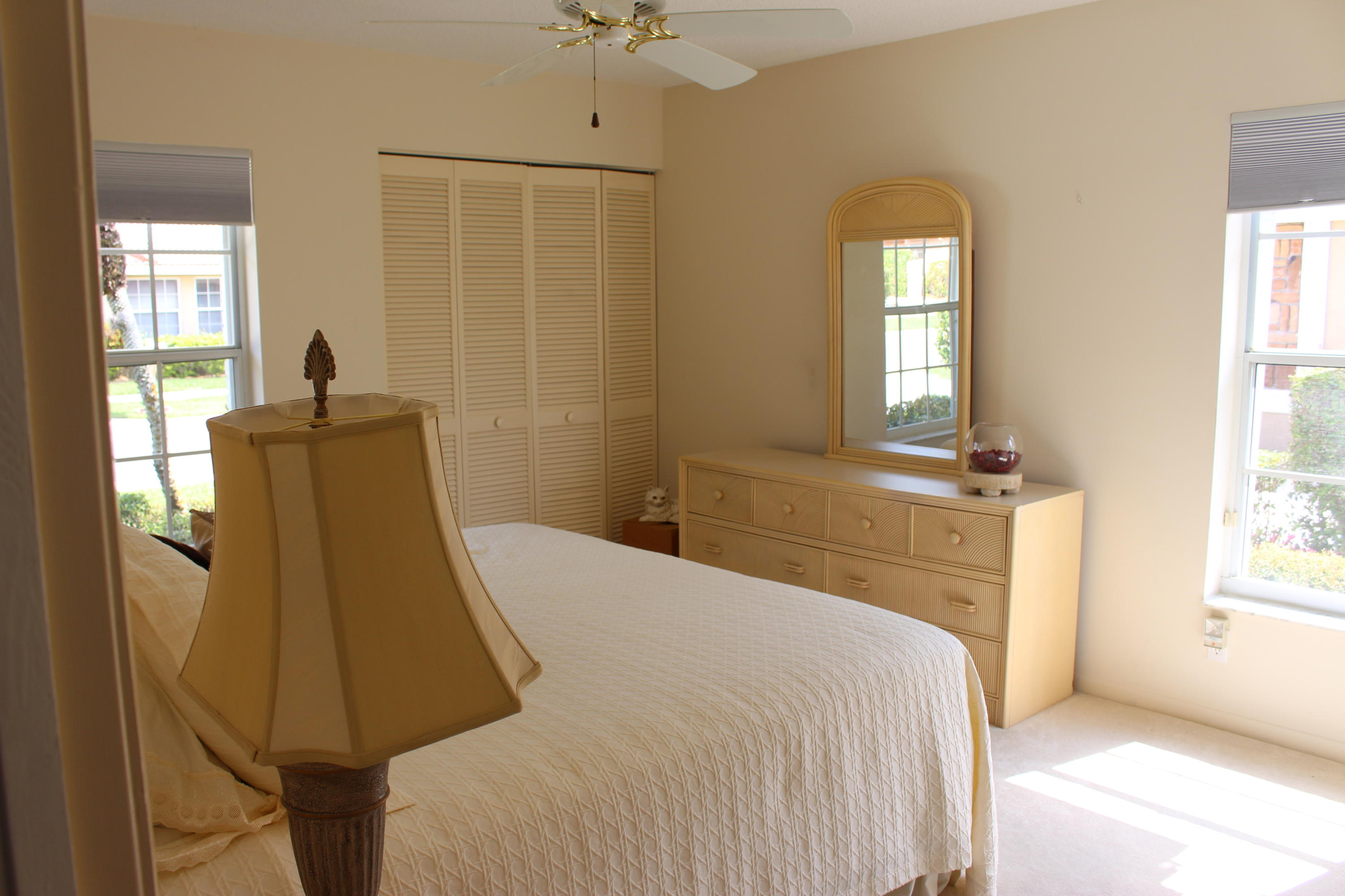 10012 Country Brook Road Boca Raton, FL 33428 - Photo 20 of 25 a bedroom with a bed and window