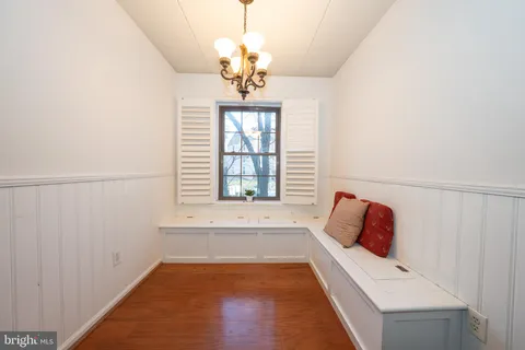 a spacious bedroom with a bed and a window