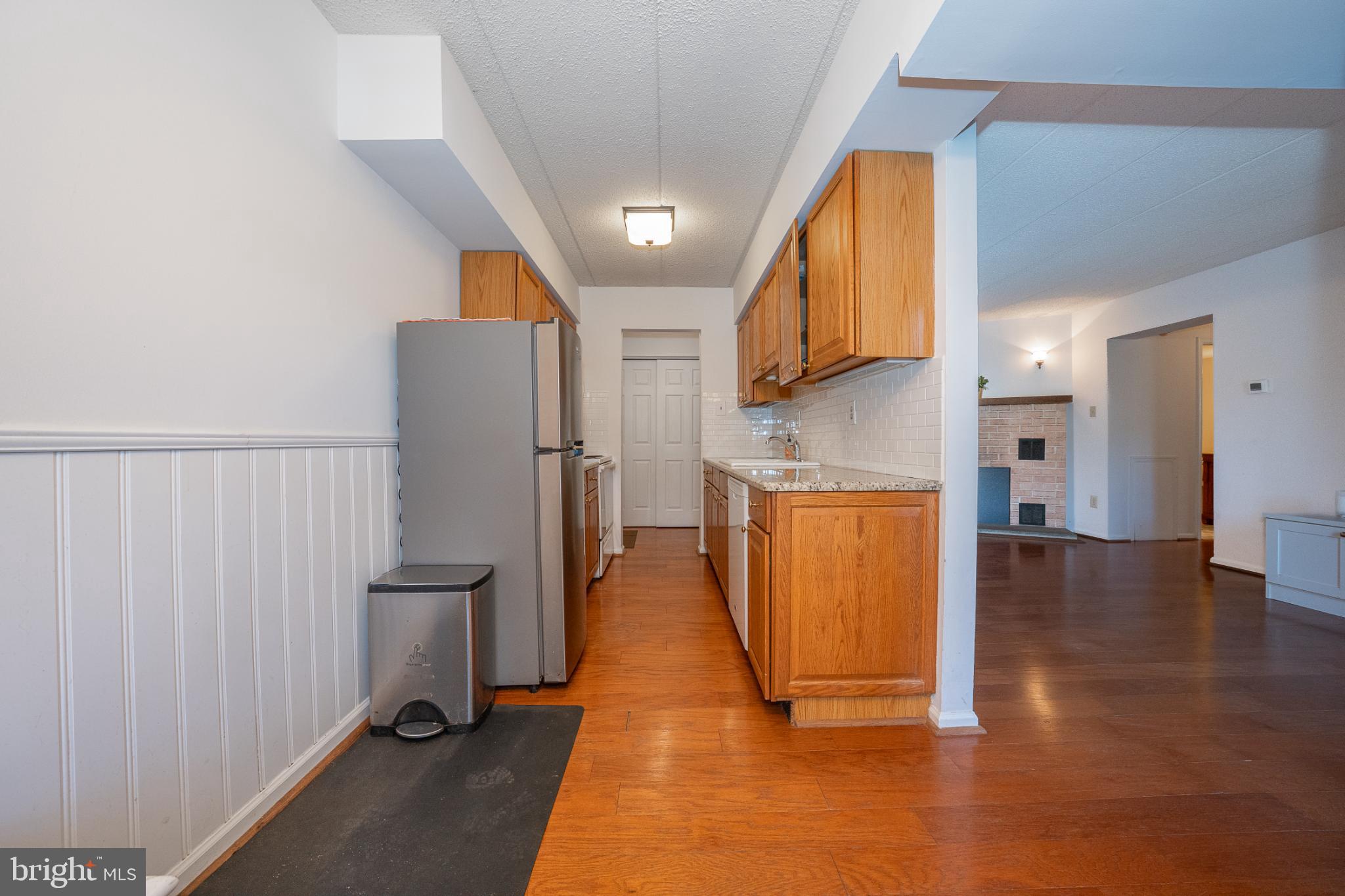 620 Washington Place, Unit 20 Chesterbrook, PA 19087 - Photo 9 of 23 a view of a kitchen with wooden floor and a refrigerator