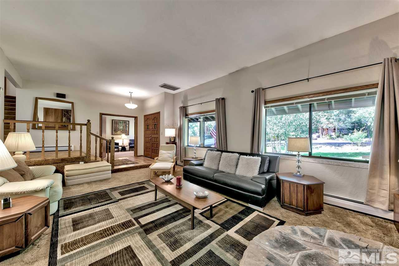 361 Summit Drive Stateline, NV 89449 - Photo 15 of 35 a living room with furniture fireplace and a large window