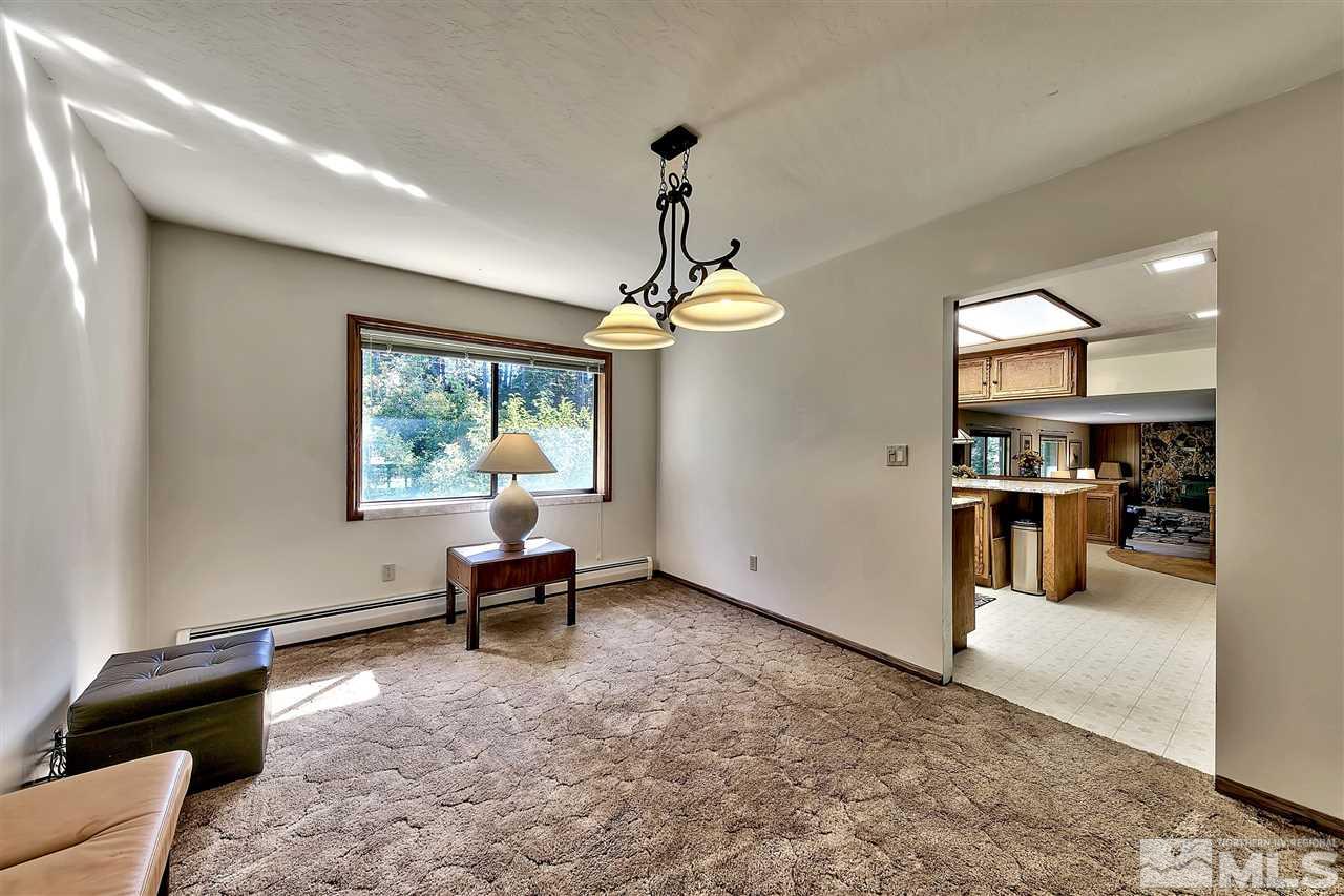 361 Summit Drive Stateline, NV 89449 - Photo 26 of 35 a living room with furniture and a chandelier