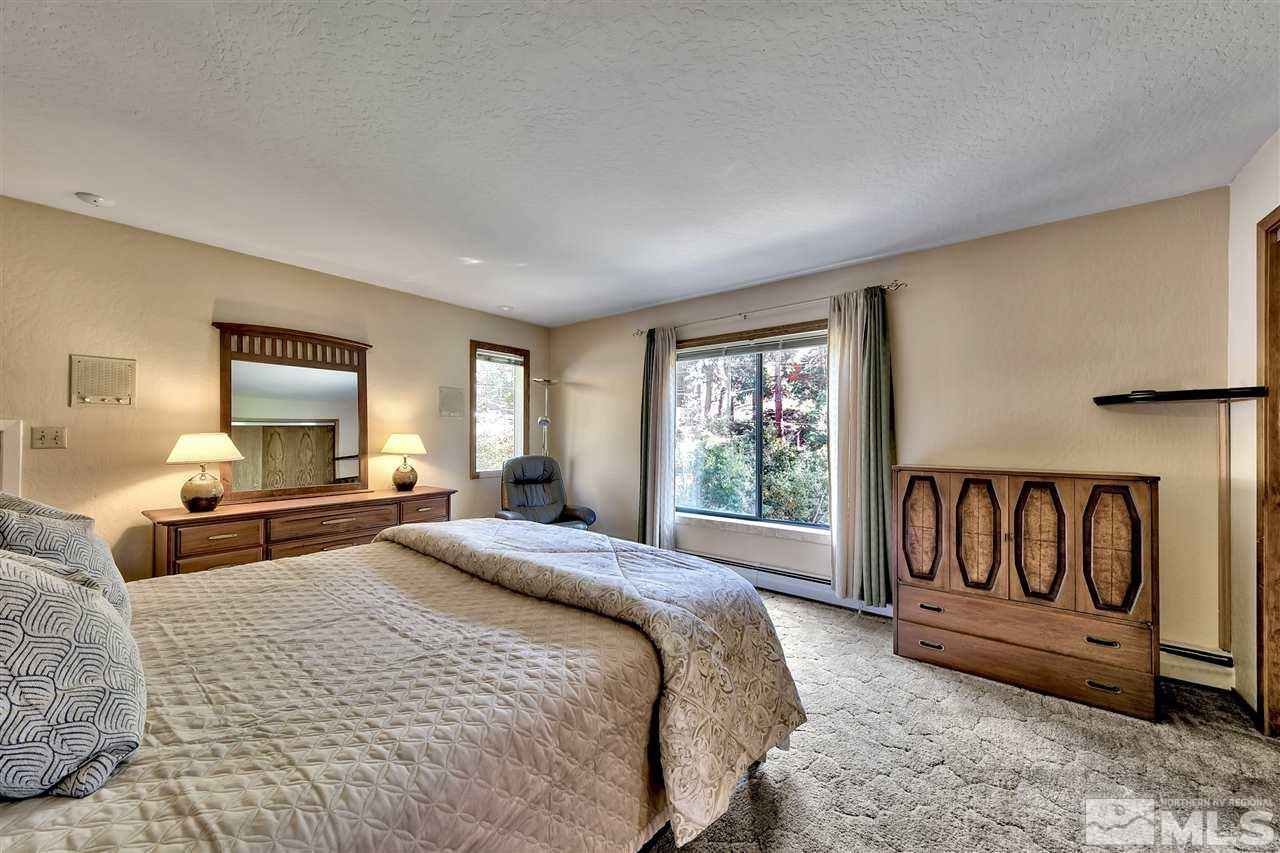 361 Summit Drive Stateline, NV 89449 - Photo 28 of 35 a bedroom with a bed and window