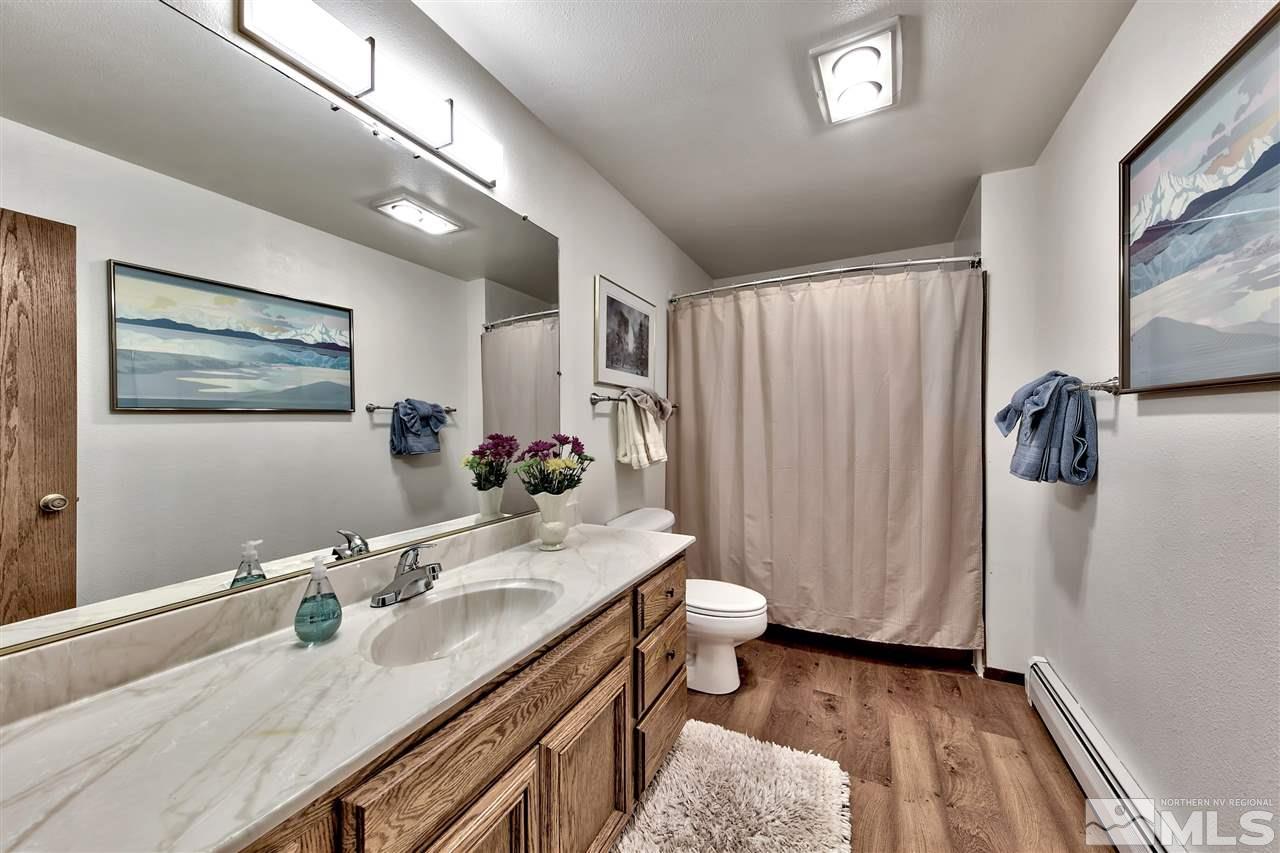 361 Summit Drive Stateline, NV 89449 - Photo 31 of 35 a bathroom with a sink a toilet a mirror and shower