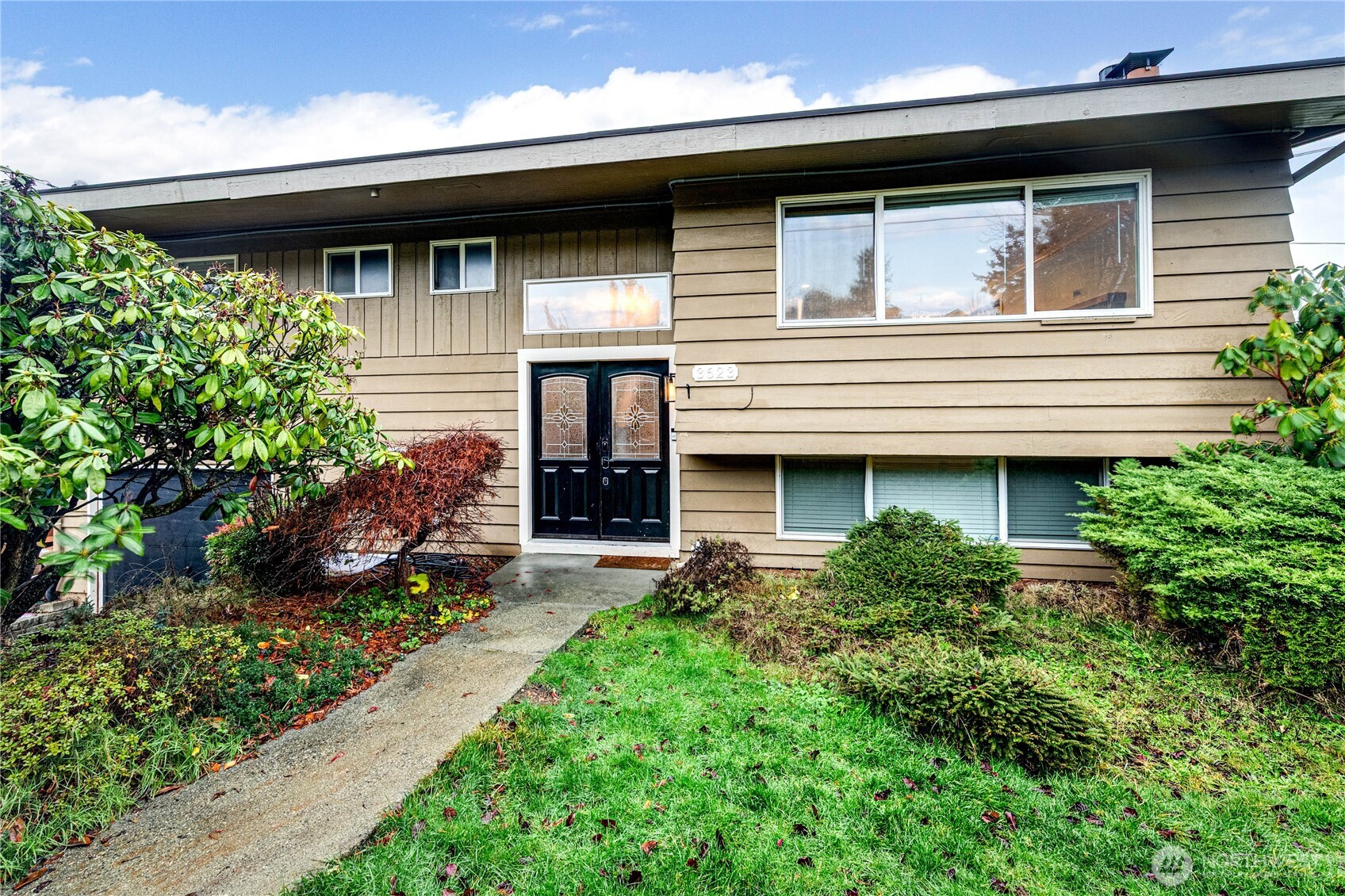 3623 Shelby Road Lynnwood, WA 98087 - Photo 1 of 39 a view of a house with potted plants and a table