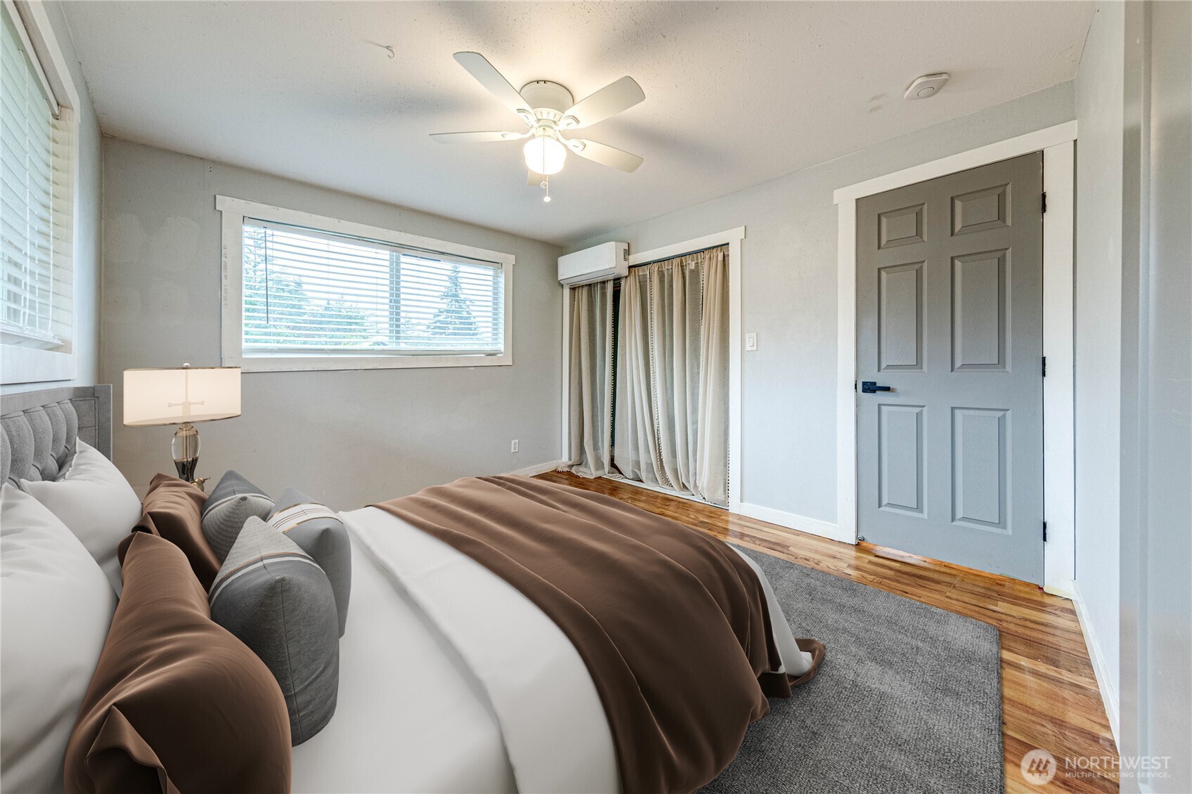 3623 Shelby Road Lynnwood, WA 98087 - Photo 15 of 39 a bedroom with a bed and a chandelier