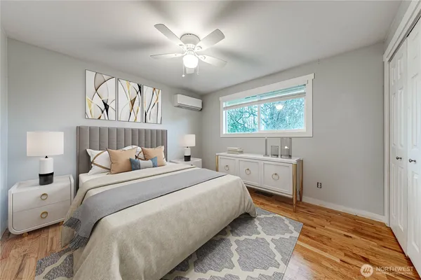 a bedroom with a large bed and a window