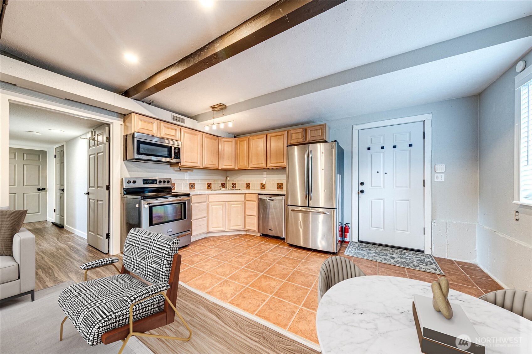 3623 Shelby Road Lynnwood, WA 98087 - Photo 23 of 39 a kitchen with a refrigerator and a stove top oven