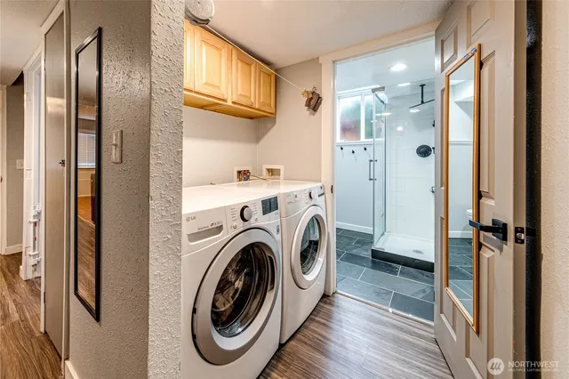 a view of a bathroom with washer and dryer
