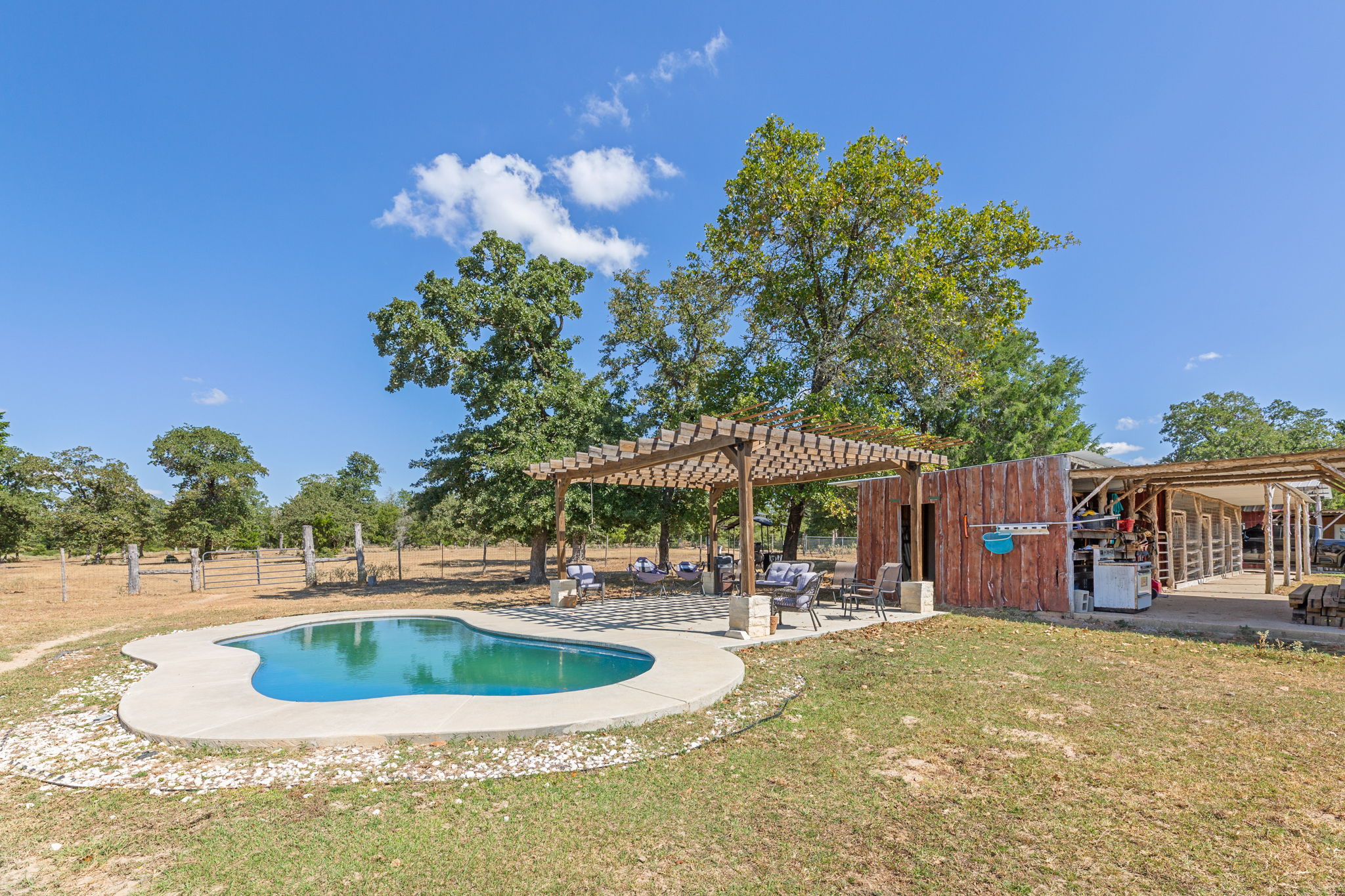 274 Old Potato Road Paige, TX 78659 - Photo 23 of 39 View of pool featuring a pergola and a patio area