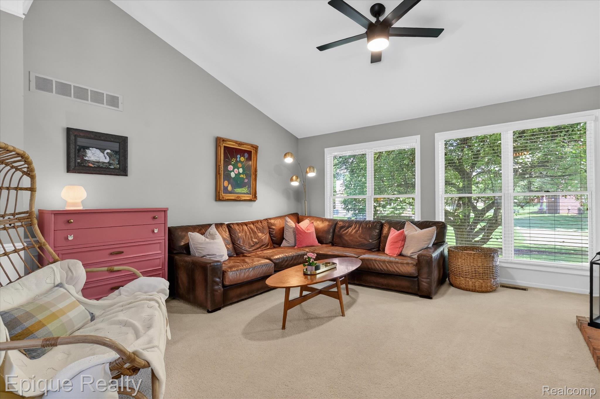 760 Caribou Court Rochester, MI 48307 - Photo 10 of 67 Living area featuring a vaulted ceiling and an integrated ceiling fan with lighting