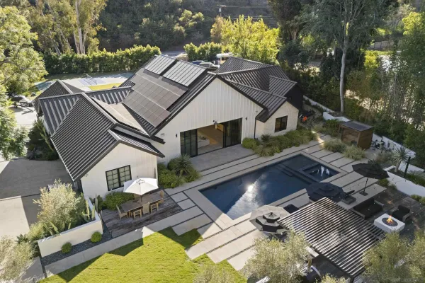 a aerial view of a house with a yard