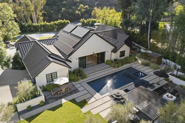 a aerial view of a house with a yard