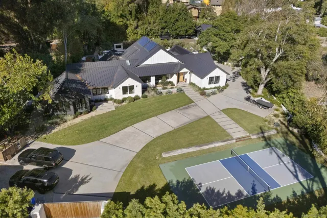 an aerial view of a house with a garden