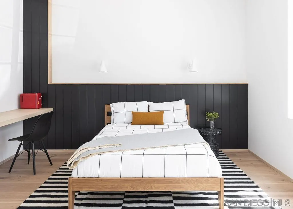 4874 Sun Valley Road Del Mar, CA 92014 - Photo 21 of 42 a bedroom with a bed and a table