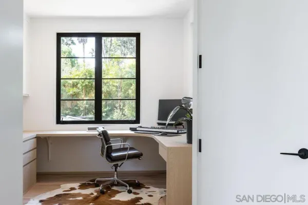 a bathroom with a sink a window and a mirror